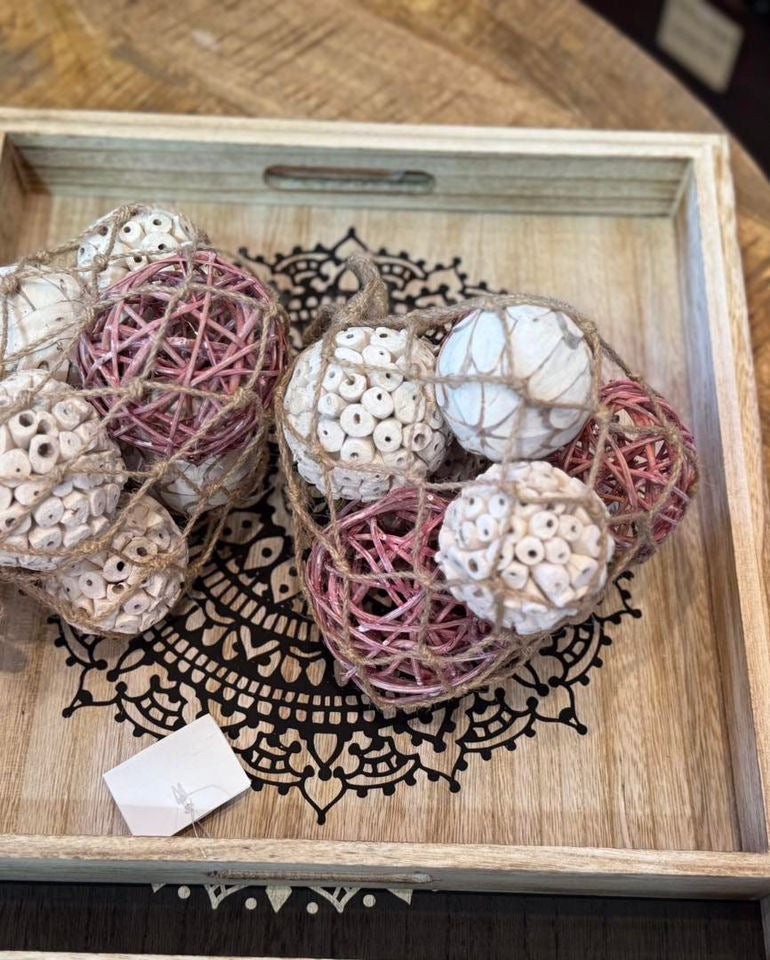 Decorative Pink and Cream balls in decorative fishnet bag